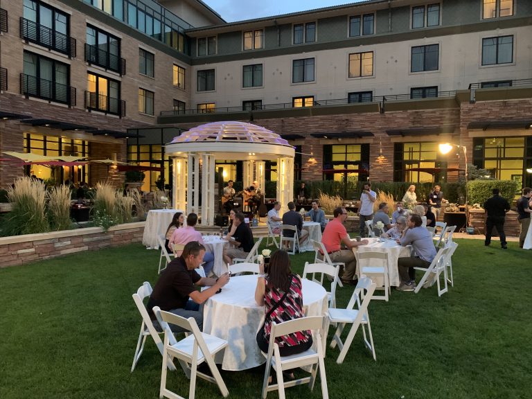Guests enjoying dinner in the grounds of St Julian for a Boulder Offsite Retreat